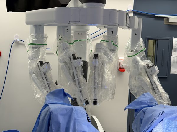 A multiport robotic surgical system positioned over the operating table